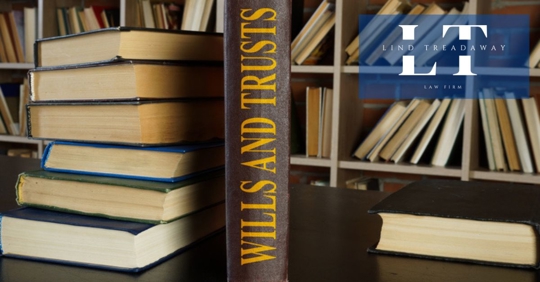 Law book about wills and trusts on the desk.